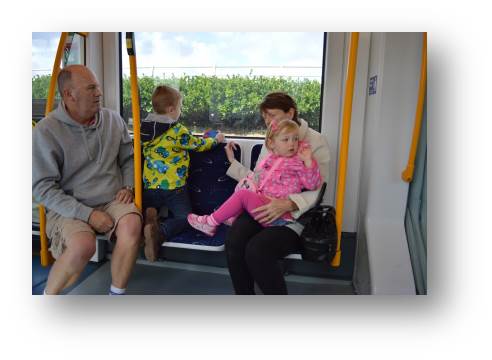Adam and Emily enjoying a train ride with the in-laws on their way to Blackpool