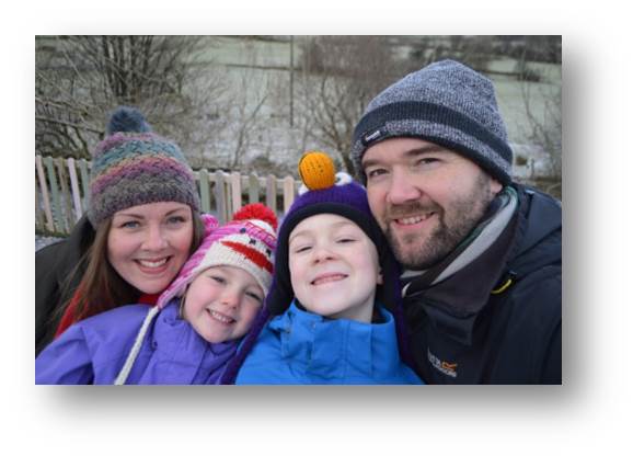 Chilly family picture with everyone wraped up warm.