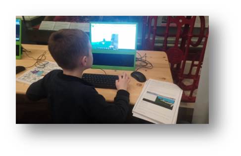 Adam trying his hand at coding in Minecraft using a Raspberry Pi computer