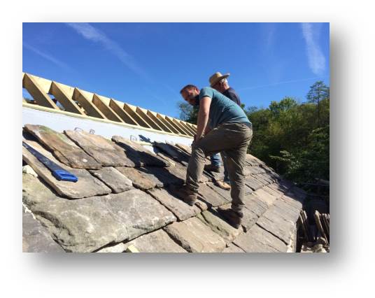 As the roof gets higher I have to perfect the climbing-hop and get onto the roof. Tentatively at first but it's clear the structure is really solid and so long as you're careful how you step on the slates, they can still wiggle a little without cracking.