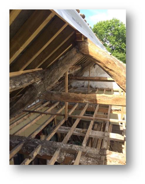 With half of the roof missing, the colours in the oak frame really pop out and I'm already looking forward to getting them cleaned up.  There is no way we can reinstate the ceiling knowing how good they look.