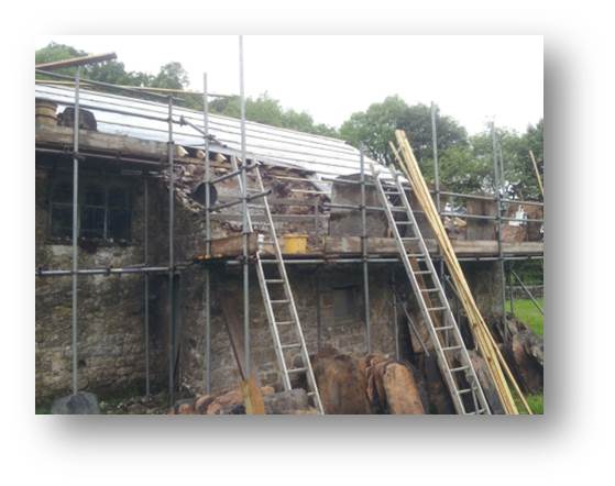 As the weather starts to turn against us, we manage to get a layer of membrane on to keep the rain at bay. Even like this, it's dryer than it was with the old roof on.