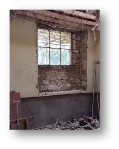 The internal window stripped back to show its original dimensions prior to opening it back up.