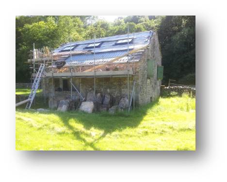With the rafters doubled up in the right locations, the huge skylights are put into place.