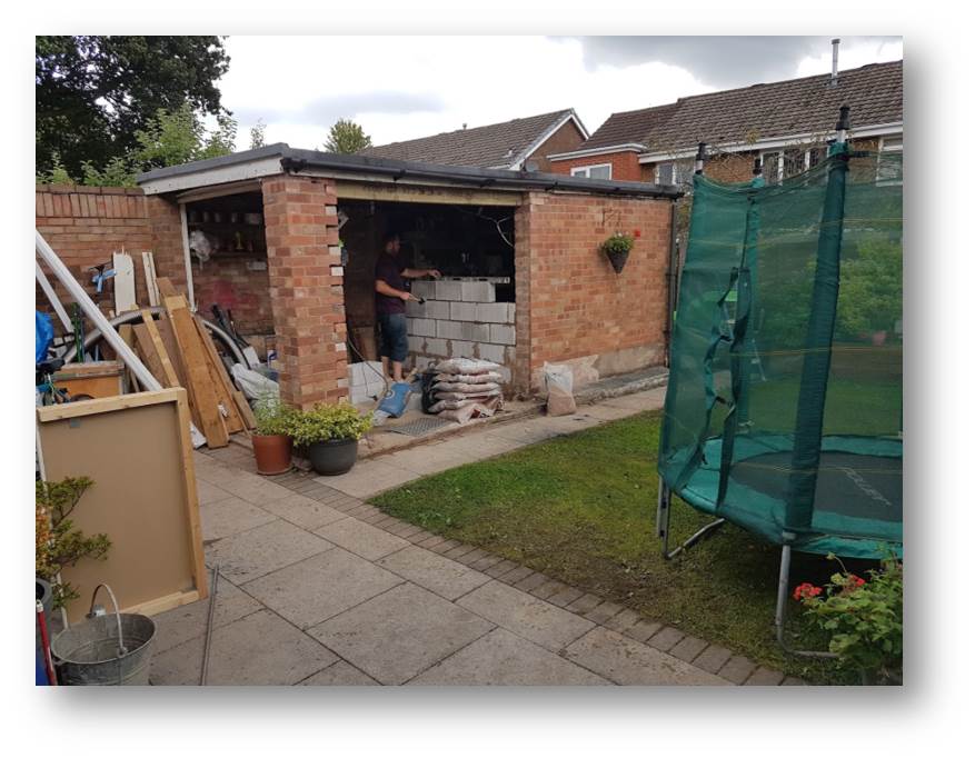 Walls, door and window removed we get started on building a new partition wall to give us two rooms from one building.