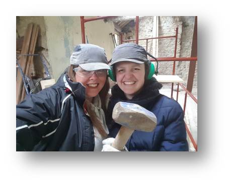 Rachel and Emma pose shortly before knocking lumps out of the walls.