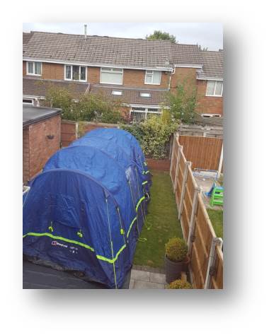 The new inflatable tent which we bought ready for our family holiday to Cornwall gets a test-run in the back garden.