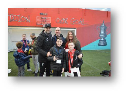 The group gets to meet Jurgen Klopp, Liverpools manager.