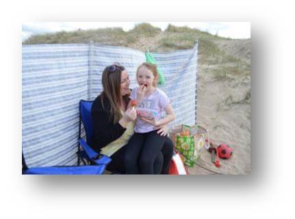 Rachel and Emily enjoying some fresh fruit at Ainsdale Beach