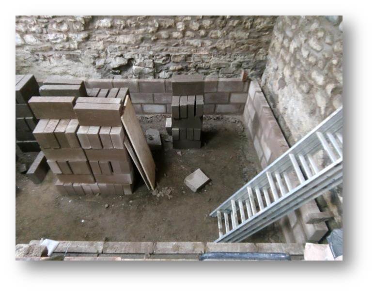 blockwork starts on the cellar walls to support the lounge floor