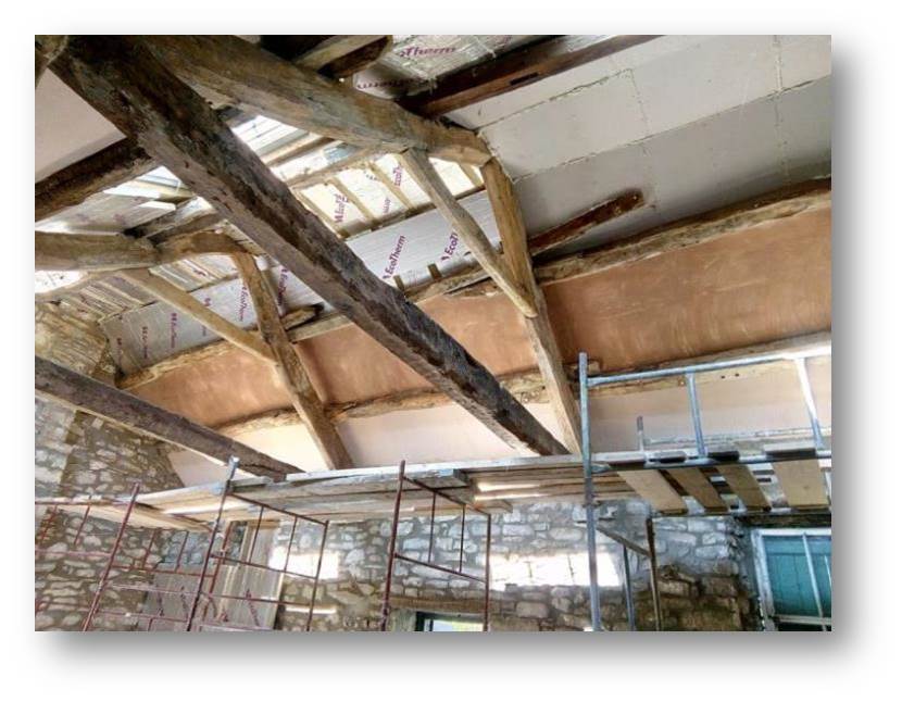 A view of the beams prior to cleaning and treating.