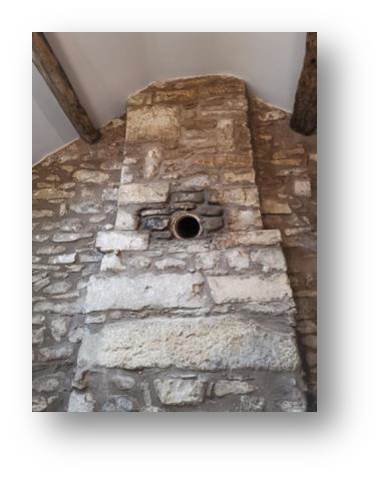 Breaking through the pointed wall for the new chimney liner