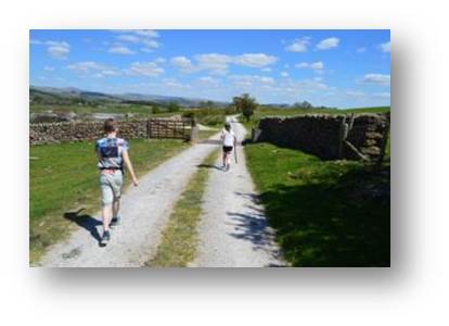 Family walk along one of the tracks which loop around the Temperance Hall