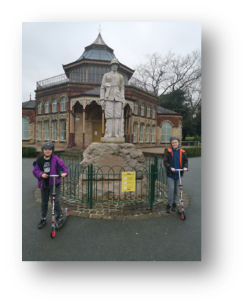 Adam and Emily in Mesnes Park in front of the Boer War memorial